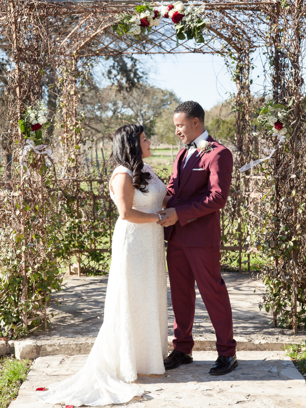 Everlasting Elopements couple holding hands under arch at Oak Valley Vineyard