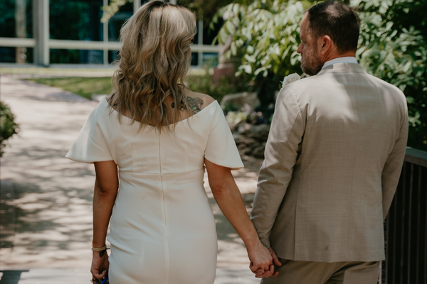 Everlasting Elopements couple holding hands walking away from the camera at Lincoln Chapel.