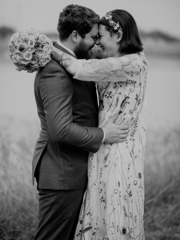 Everlasting Elopements posing and laughing after wedding ceremony