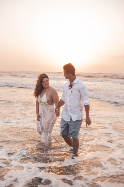 Everlasting Elopements couple staring at eachother on beach